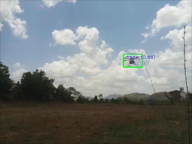A drone flying against clouds over farmland, tracked by a green box